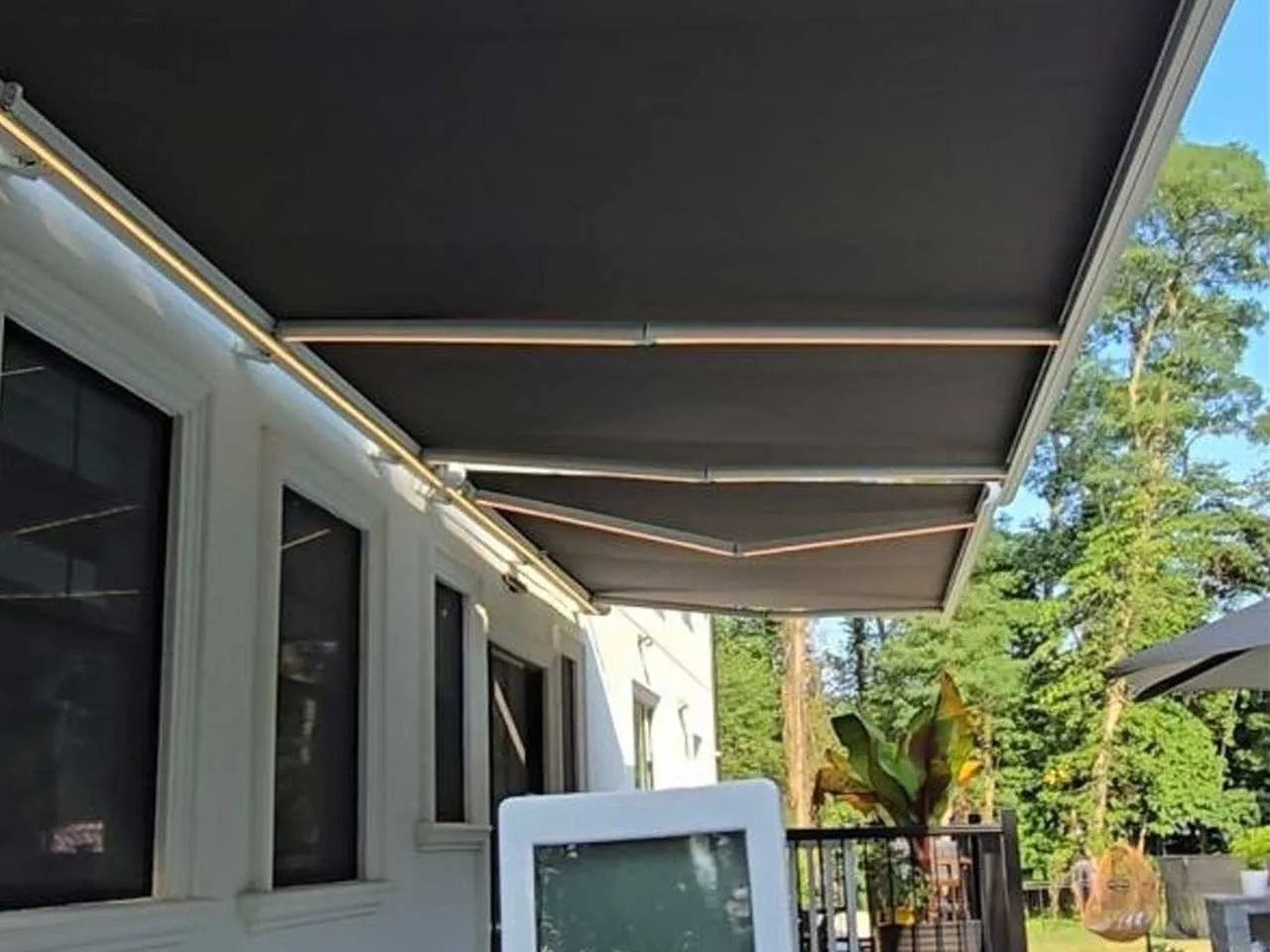 Underside of the extended awning with LED strips along the arms