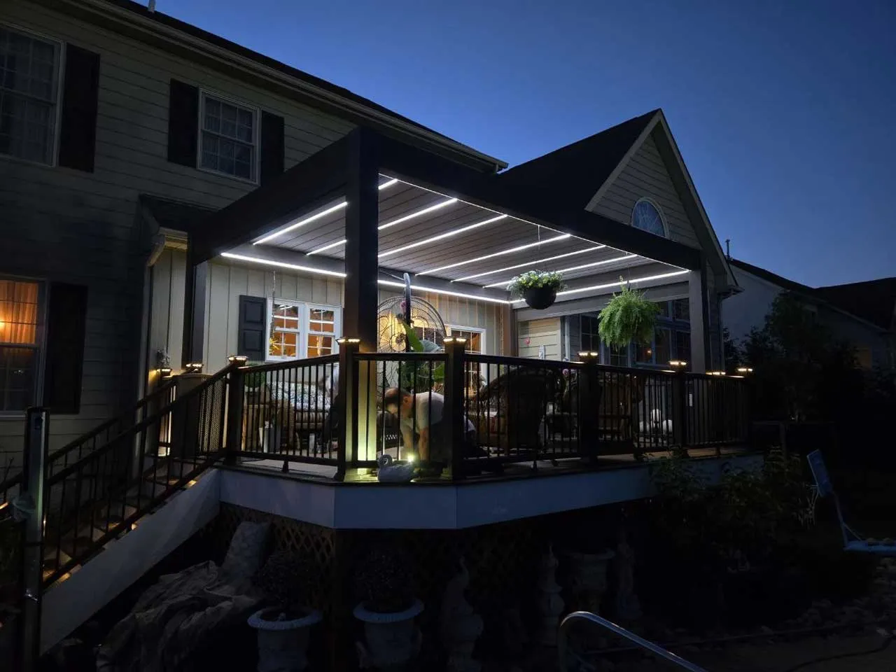 The finished pergola at dusk with LED lighting along the louvers